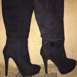 All black knee high heeled boots